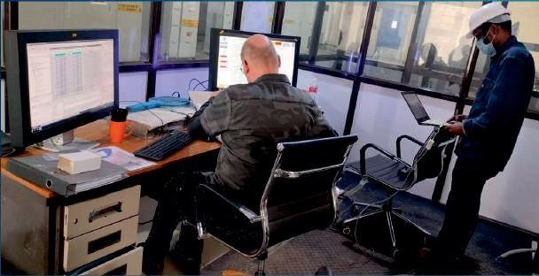 Automation engineers in control room